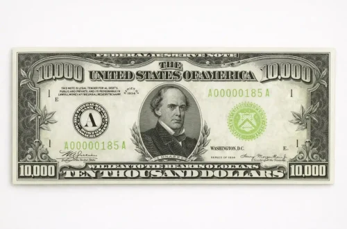 Front of a $10,000 bill with Salmon P. Chase on a light background.