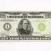 Front of a $10,000 bill with Salmon P. Chase on a light background.